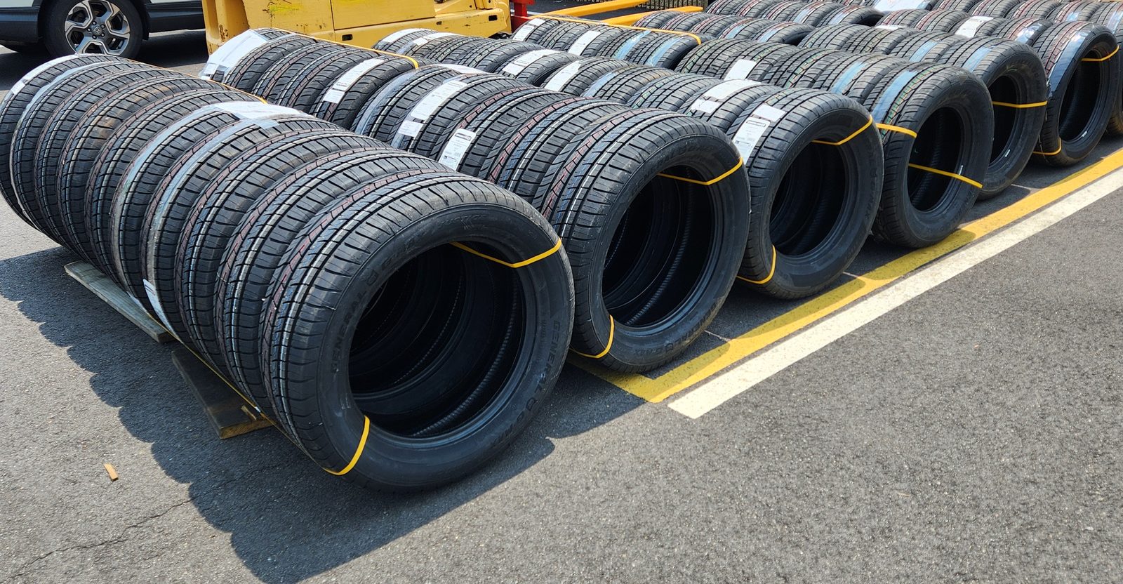 Rows of new tires staged outside the Toota facility
