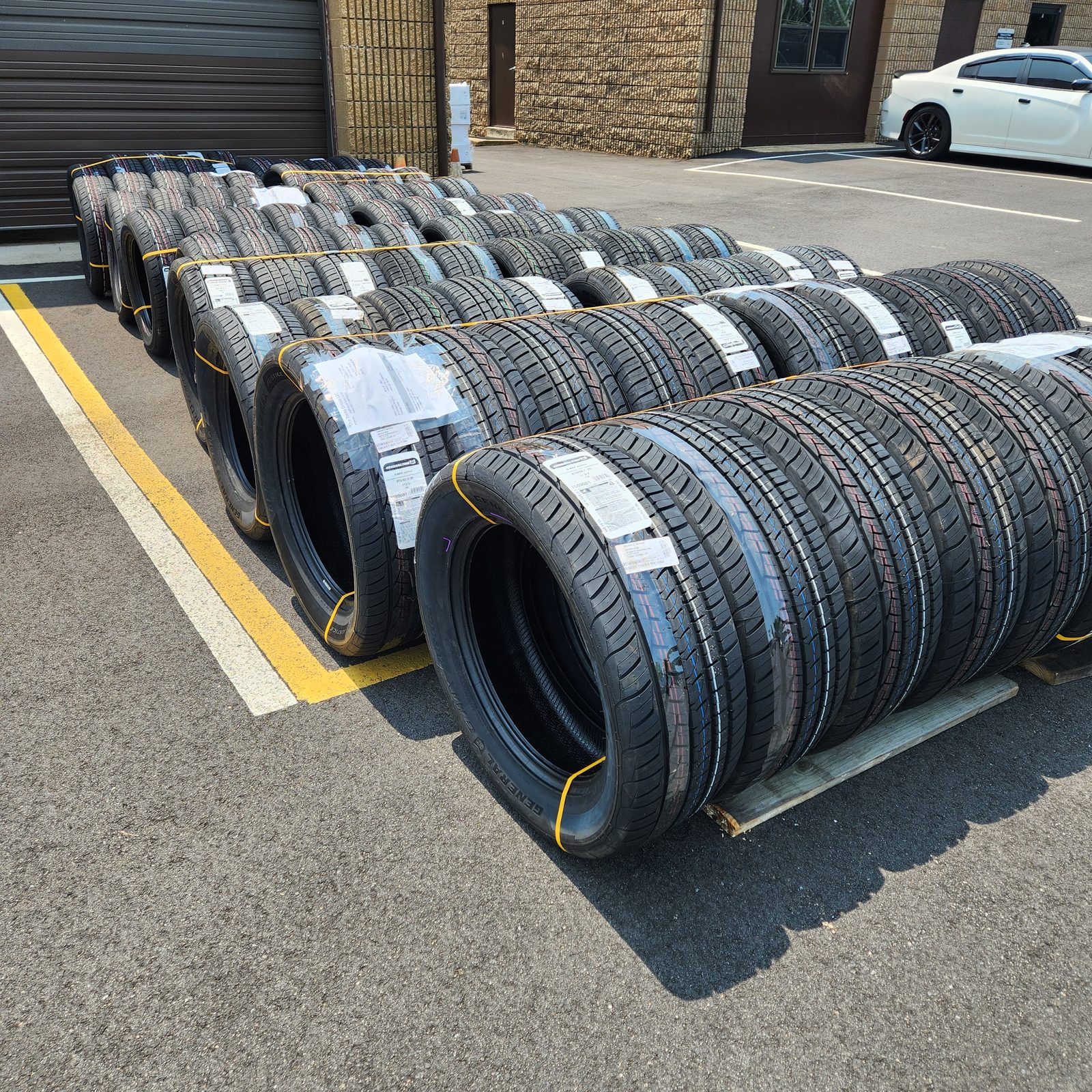 Stacks of new General and Continental tires banded for shipment